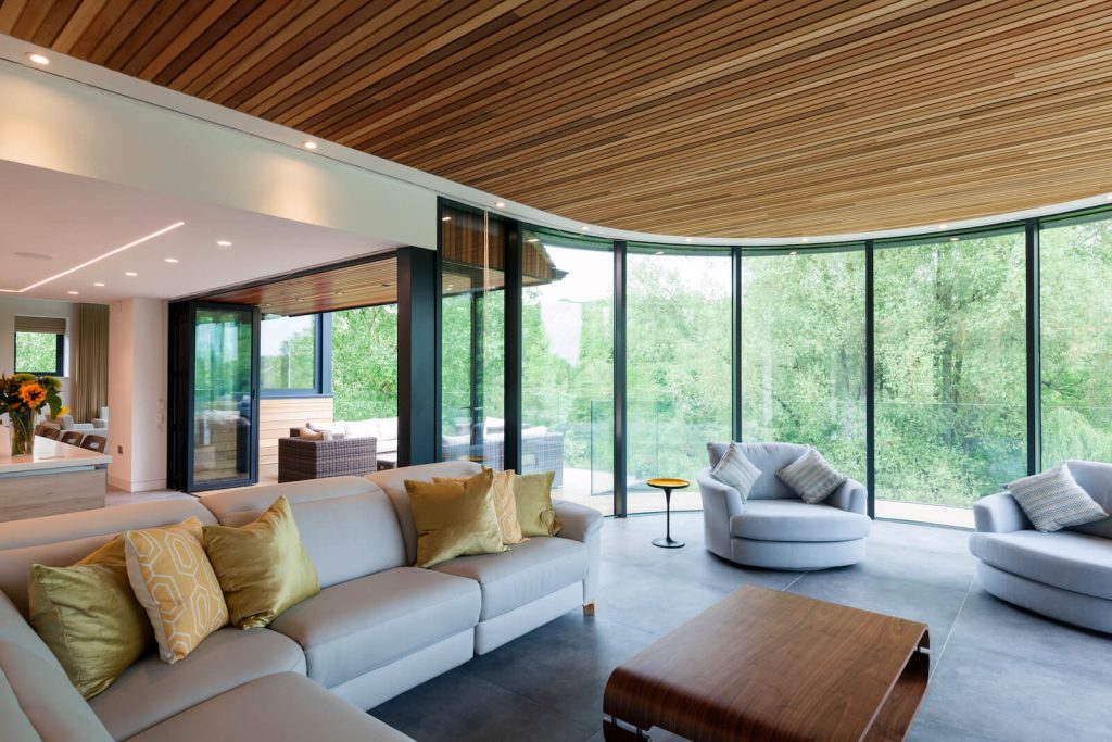 Smart curved bifold door in a modern home
